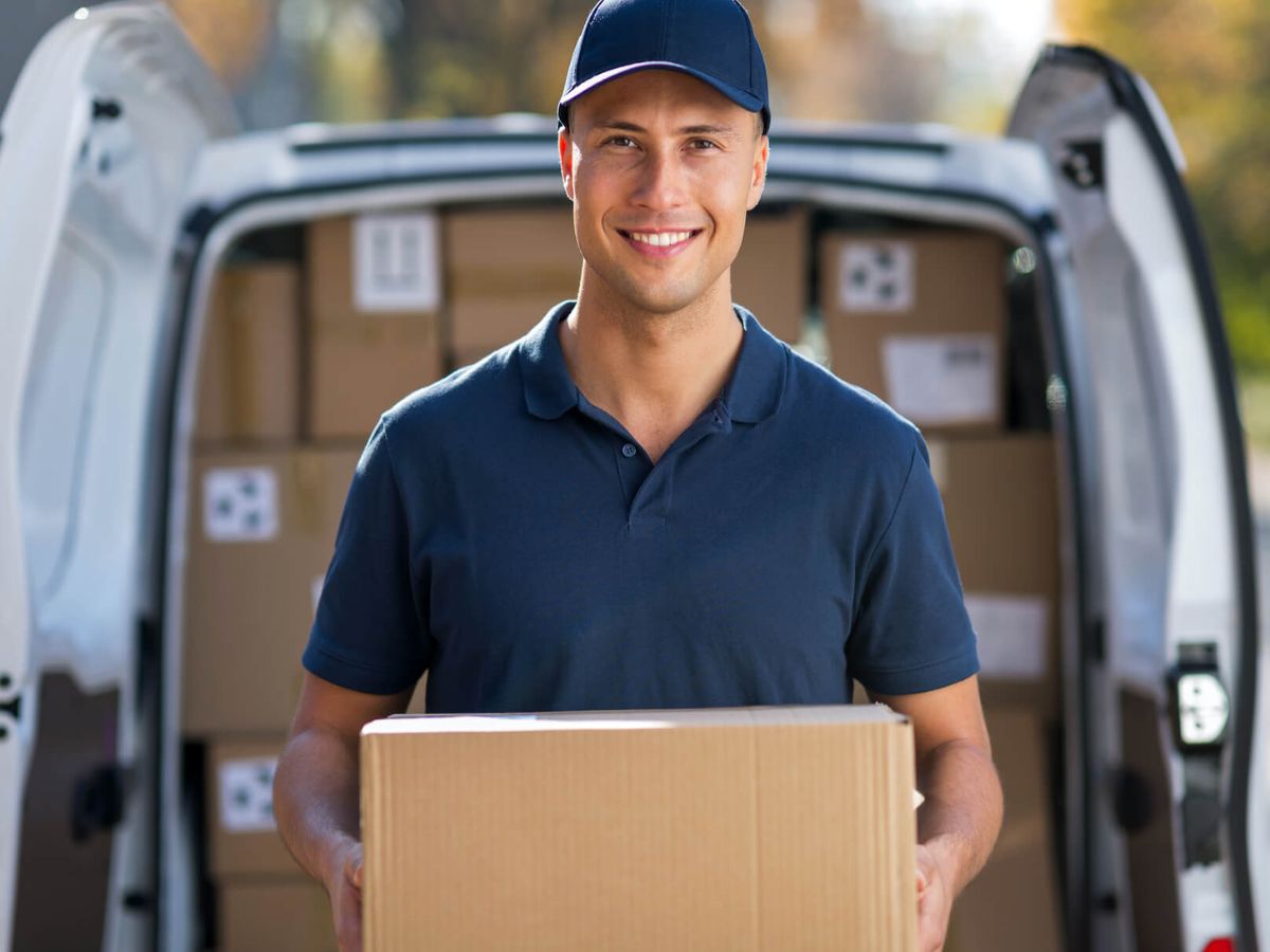 Delivery rider and packages showing Nigerian to U.S. shipping